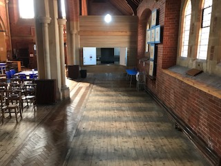 North aisle cleared of 8 pews.