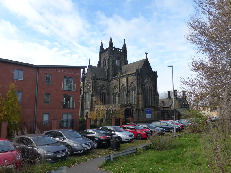Exterior North west towards the church which drops down dramatically at the west end towards the River Aire.