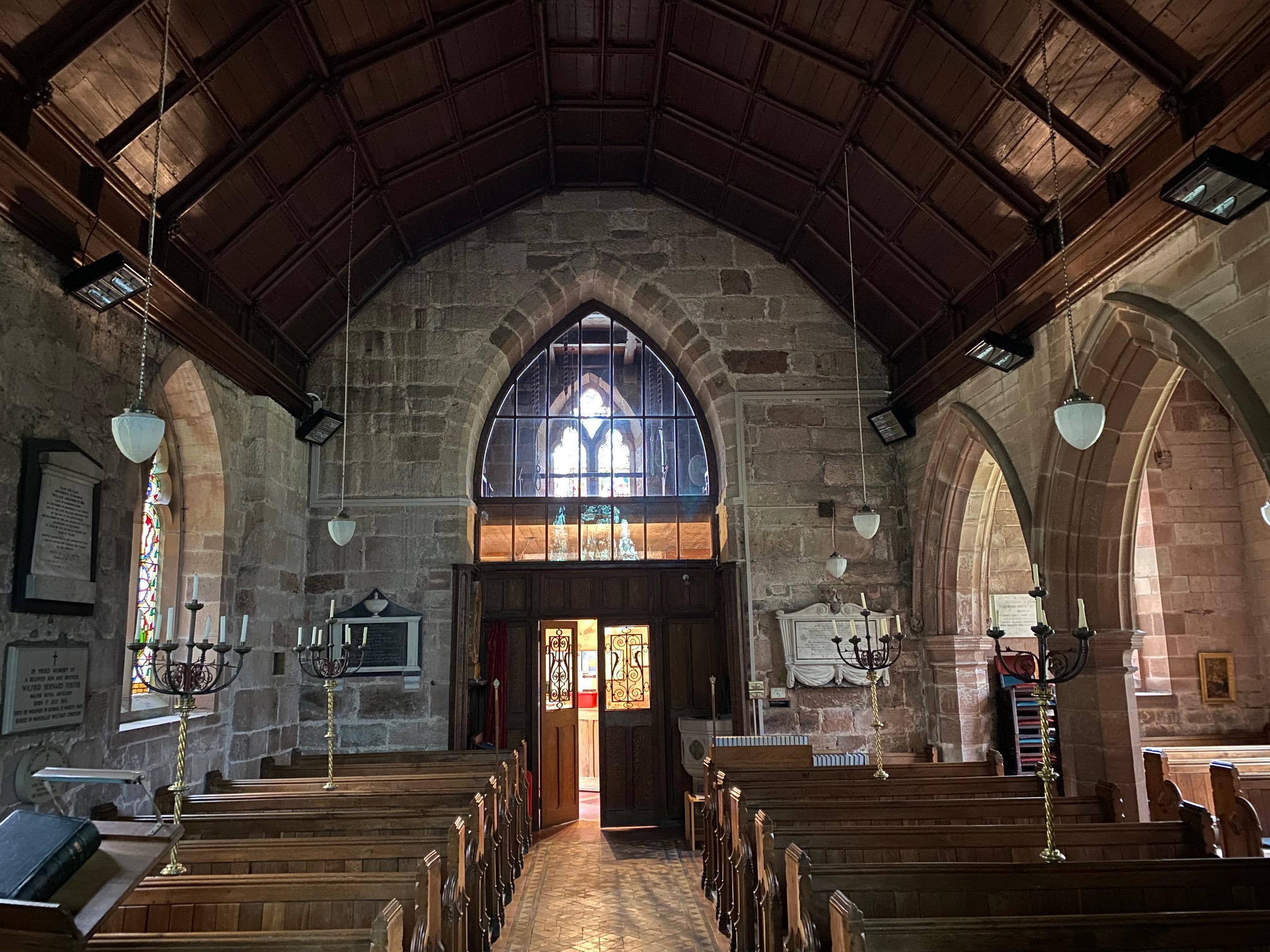 Photograph of installed heaters and conduits on West Wall Nave